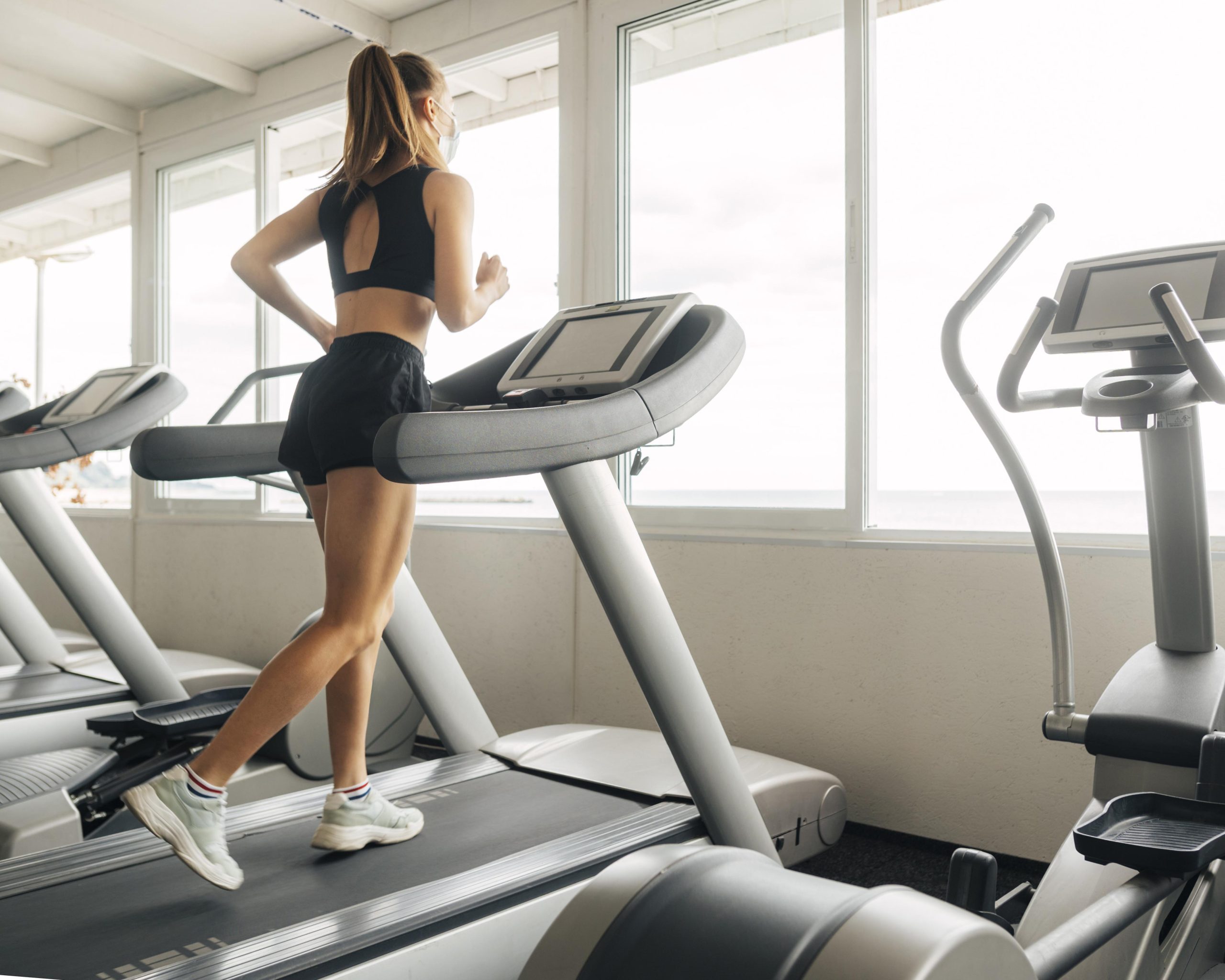 woman is using treadmill gym